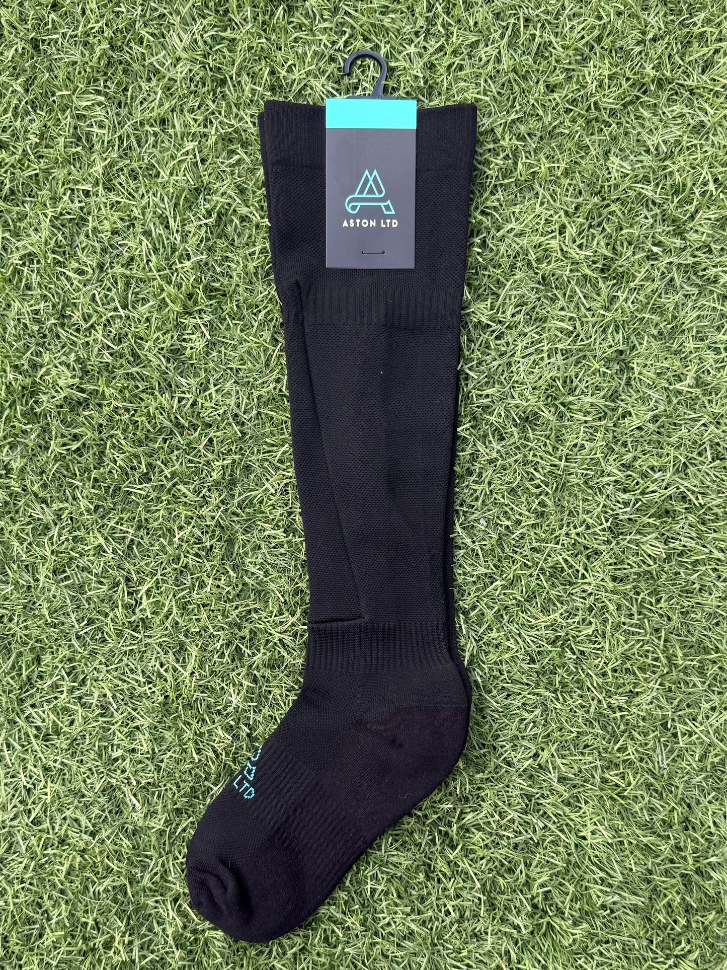 Black knee high soccer sock with built in shin guard pocket