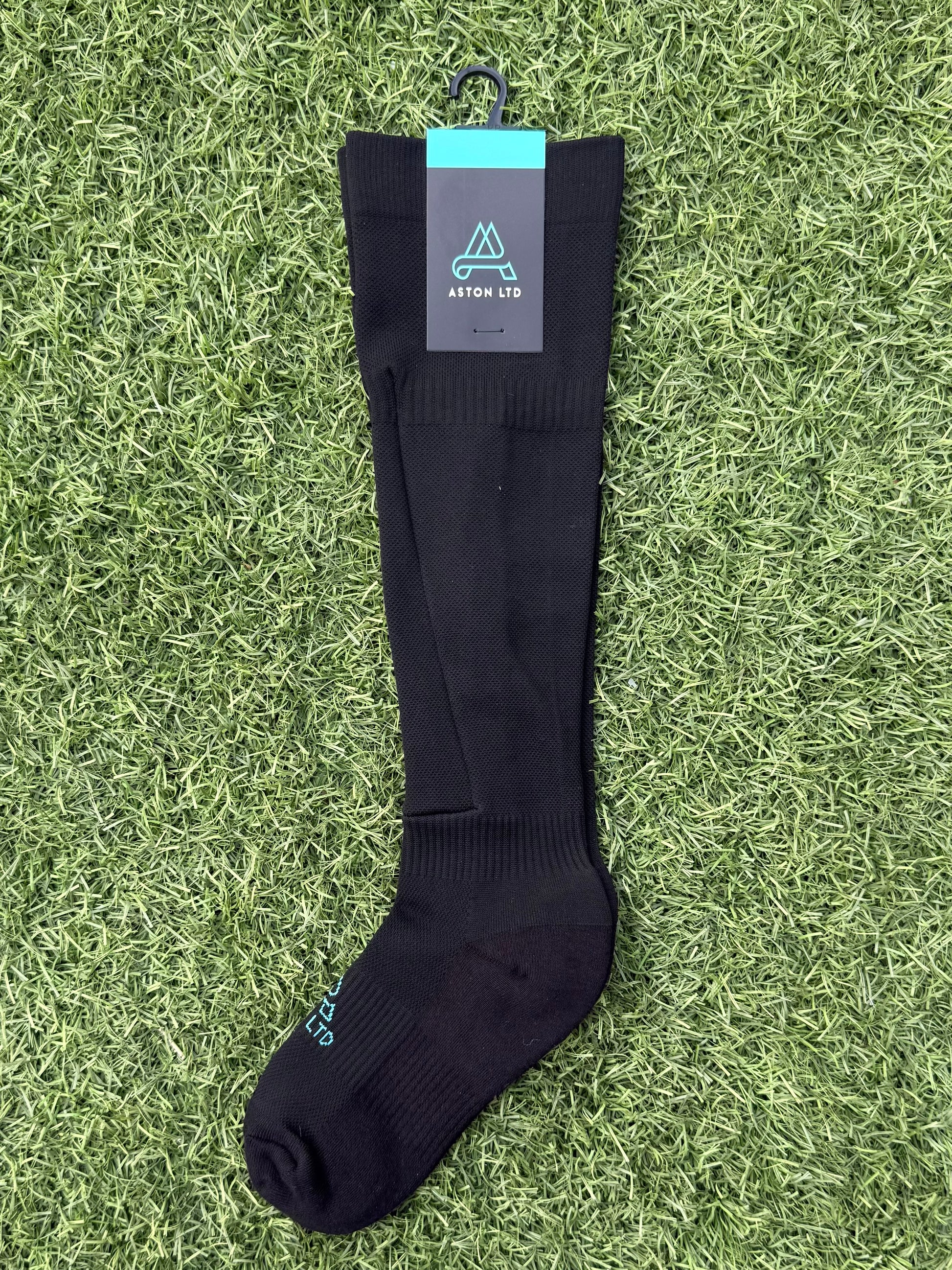 Black knee high soccer sock with built in shin guard pocket